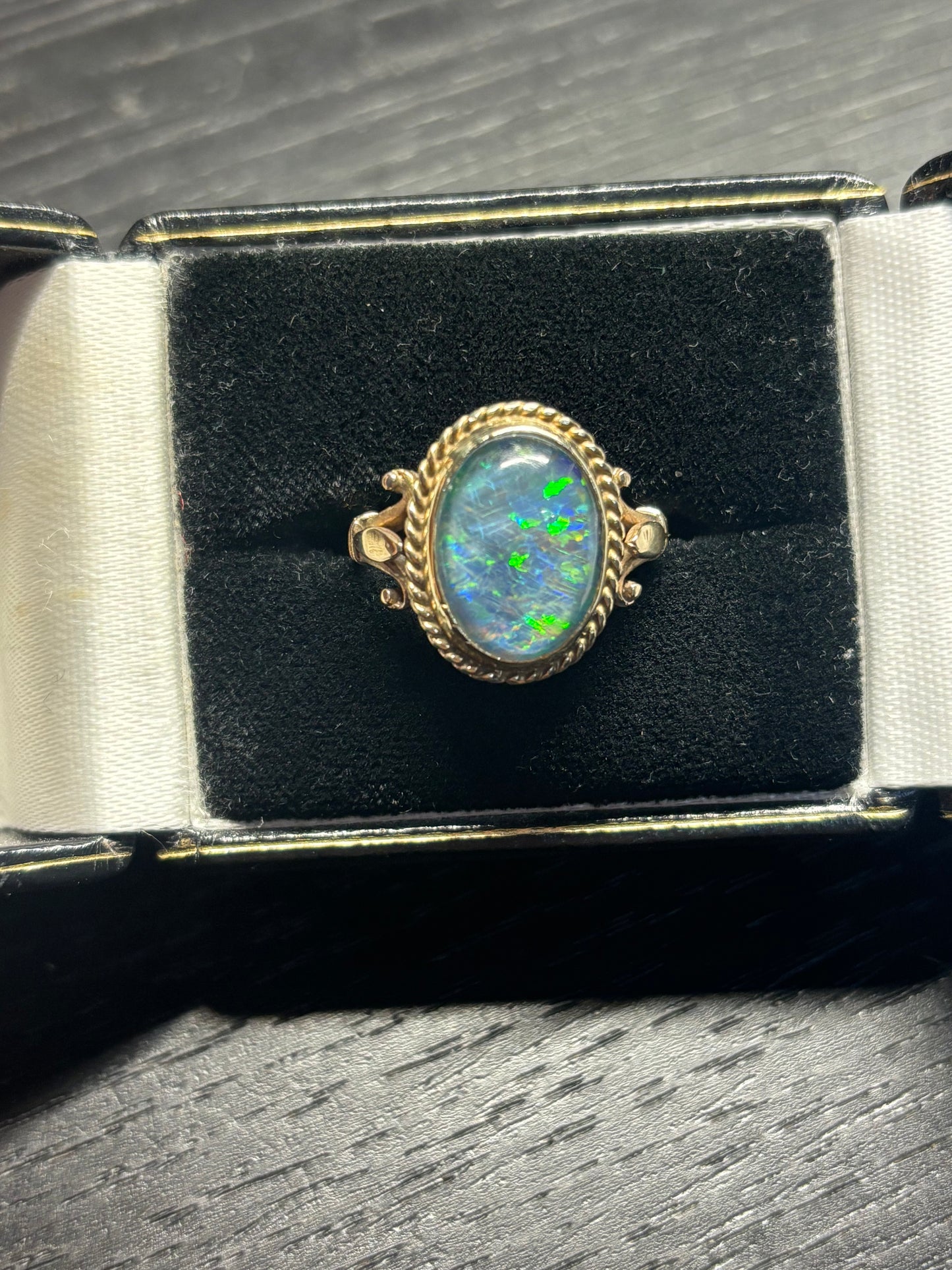 Bright and fiery opal ring set in 9ct gold