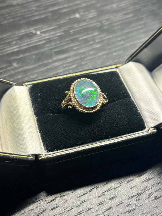 Bright and fiery opal ring set in 9ct gold